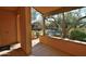 Covered patio overlooking a courtyard with trees and a pool at 20704 N 90Th Pl # 1008, Scottsdale, AZ 85255