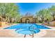 Community pool and spa with lounge chairs and covered patio at 20704 N 90Th Pl # 1008, Scottsdale, AZ 85255