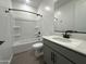 Well-lit bathroom showcasing a tub and shower, a modern vanity, and a matching mirror at 22852 E Lords Way, Queen Creek, AZ 85142