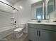 Bathroom featuring a shower-tub combo, neutral paint, and a sink with vanity at 22852 E Lords Way, Queen Creek, AZ 85142