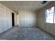 Unfinished bedroom with window and closet at 22852 E Lords Way, Queen Creek, AZ 85142