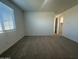 Bedroom with carpet floors, a window with blinds, and closet access at 22852 E Lords Way, Queen Creek, AZ 85142