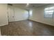 Bedroom featuring wood-style flooring, neutral paint, and a closet at 22852 E Lords Way, Queen Creek, AZ 85142