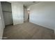 Bright bedroom with a closet, neutral walls, and carpeted floors, providing a cozy feel at 22852 E Lords Way, Queen Creek, AZ 85142