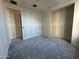 Bright bedroom featuring ample space and two closets at 22852 E Lords Way, Queen Creek, AZ 85142