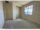 Unfinished bedroom with window and closet at 22852 E Lords Way, Queen Creek, AZ 85142