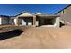 New single-story home with attached garage and front porch at 22852 E Lords Way, Queen Creek, AZ 85142