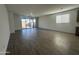 Spacious living room area showcasing tile floors, lots of natural light, and neutral walls at 22852 E Lords Way, Queen Creek, AZ 85142