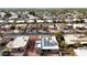 Aerial view showing a neighborhood with a house featuring solar panels at 25417 S Kansas Ave, Sun Lakes, AZ 85248