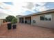 Spacious backyard with covered patio, gravel landscaping, and citrus trees at 25417 S Kansas Ave, Sun Lakes, AZ 85248