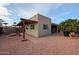 Home exterior showcasing a pergola and well-maintained landscaping at 25417 S Kansas Ave, Sun Lakes, AZ 85248