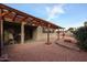 Relaxing backyard patio with pergola, fire pit, and seating area at 25417 S Kansas Ave, Sun Lakes, AZ 85248