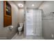 Clean bathroom with toilet, shower, and shelving at 25417 S Kansas Ave, Sun Lakes, AZ 85248