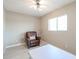 Relaxing bedroom with a comfortable armchair and large window at 25417 S Kansas Ave, Sun Lakes, AZ 85248