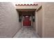 Home entry with a red door and tile flooring at 25417 S Kansas Ave, Sun Lakes, AZ 85248