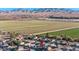 Aerial view showcasing the property's location near farmland and mountains at 25583 W Beth Dr, Buckeye, AZ 85326