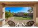 Relaxing backyard oasis with grassy area, covered patio, and hot tub at 25583 W Beth Dr, Buckeye, AZ 85326