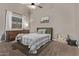 Cozy bedroom with a green headboard and built-in dresser at 25583 W Beth Dr, Buckeye, AZ 85326