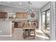 Kitchen dining area with farmhouse table and sliding glass door at 25583 W Beth Dr, Buckeye, AZ 85326