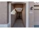 Covered entryway with arched walkway leading to front door at 25583 W Beth Dr, Buckeye, AZ 85326