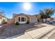 Single story home with tan exterior and a two car garage at 25583 W Beth Dr, Buckeye, AZ 85326