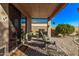 Covered patio with comfortable seating and built-in grill at 25583 W Beth Dr, Buckeye, AZ 85326