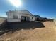 Rear view of a new home under construction with scaffolding at 2674 E Abe Truckle Ave, San Tan Valley, AZ 85140