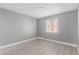 Spacious bedroom with gray walls and a window with blinds at 2847 N 46Th Ave # 8, Phoenix, AZ 85035