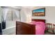 Bedroom with a wooden bed frame and pink bedding at 3034 N Ricardo --, Mesa, AZ 85215