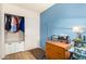 Bedroom with a wooden dresser, closet, and soft blue walls at 3034 N Ricardo --, Mesa, AZ 85215