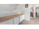 Light and bright hallway with built-in cabinetry and wood countertop at 3034 N Ricardo --, Mesa, AZ 85215