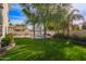 Landscaped backyard showcasing a refreshing pool and spacious lawn at 3124 N Sage Cir, Avondale, AZ 85392