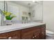 Updated bathroom with a modern vanity, speckled countertop and a new toilet at 3124 N Sage Cir, Avondale, AZ 85392