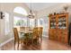 Bright dining area with wood table and chairs, and built-in hutch at 3124 N Sage Cir, Avondale, AZ 85392