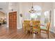 Charming dining room with wood table and chairs, near the entryway at 3124 N Sage Cir, Avondale, AZ 85392