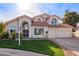 Two-story house with a landscaped lawn, attached garage, and neutral color scheme at 3124 N Sage Cir, Avondale, AZ 85392