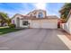 Two-story house with a landscaped lawn, attached garage, and neutral color scheme at 3124 N Sage Cir, Avondale, AZ 85392