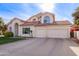 Two-story house with a landscaped lawn, attached garage, and neutral color scheme at 3124 N Sage Cir, Avondale, AZ 85392