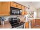 Kitchen features stainless steel appliances and wood cabinetry at 3124 N Sage Cir, Avondale, AZ 85392