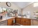 Bright kitchen features ample cabinetry, a large island, and stainless steel appliances at 3124 N Sage Cir, Avondale, AZ 85392