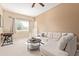 Comfortable living room featuring a sectional sofa and a rocking chair at 3124 N Sage Cir, Avondale, AZ 85392