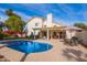 Inviting backyard oasis with a sparkling pool and patio furniture at 3124 N Sage Cir, Avondale, AZ 85392