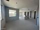 Unfinished living room with drywall and large window at 32091 N Saddlehorn Dr, San Tan Valley, AZ 85140