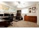 Home office featuring wood furniture, carpet flooring, and ample workspace at 3213 N 41St Pl, Phoenix, AZ 85018