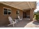 Inviting front porch with two white adirondack chairs and a bench at 3213 N 41St Pl, Phoenix, AZ 85018