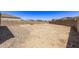 Large backyard with gravel and block wall at 3317 N 300Th Dr, Buckeye, AZ 85396