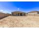 Backyard view of home with gravel at 3317 N 300Th Dr, Buckeye, AZ 85396