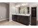 Bathroom with double vanity and storage cabinet at 3317 N 300Th Dr, Buckeye, AZ 85396