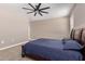 Spacious bedroom with ceiling fan and carpet at 3317 N 300Th Dr, Buckeye, AZ 85396