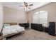 Main bedroom with window, desk and dresser at 3317 N 300Th Dr, Buckeye, AZ 85396